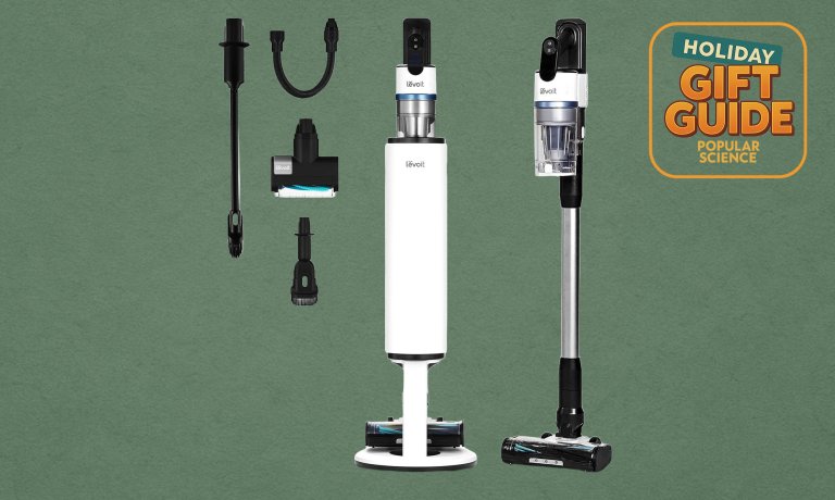 A white Levoit AERO Premium cordless vacuum, base station, and attachments on a green holiday gift guide background