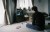 man sits on floor playing video game