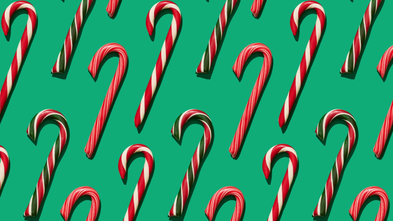 red and white and red and green candy canes on a green background