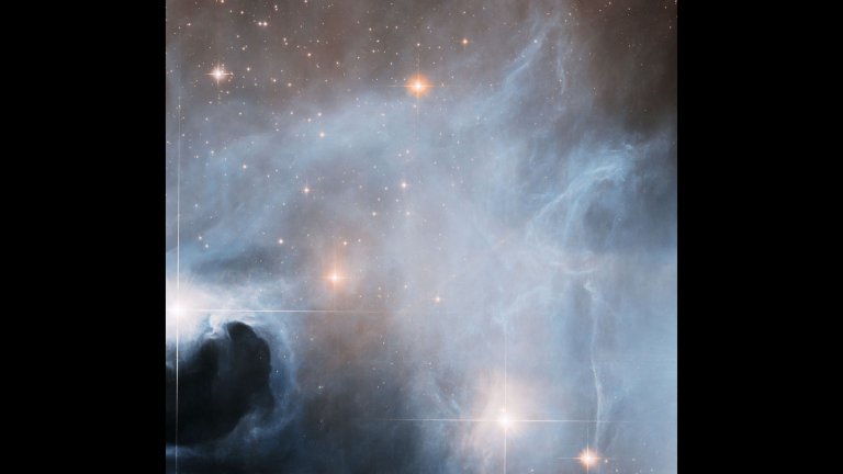 A seemingly serene landscape of gas and dust is hopping with star formation behind the scenes.