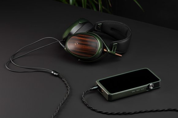 Hero image of the Meze Audio STRADA closed back dynamic driver headphones connected to a DAP