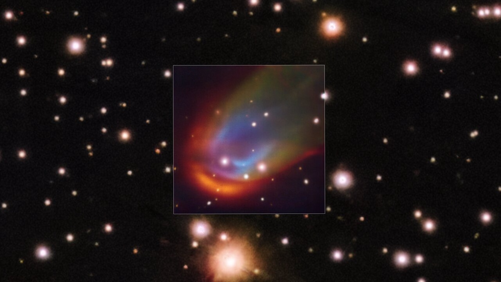 The central square image, taken with the MUSE instrument on ESO’s Very Large Telescope, shows shock waves around the dead star RXJ0528+2838. When a star moves through space it can push away nearby material creating a so-called bow shock, which in this image is glowing in red, green and blue. The colours represent hydrogen, nitrogen and oxygen, respectively. These shocks are usually produced by a strong outflow expelled from the star. However, in the case of RXJ0528+2838 –– a white dwarf with a Sun-like companion –– astronomers discovered that the shock wave can’t be explained by any known mechanism. Some hidden energy source, perhaps magnetic fields, could be the answer to this mystery.