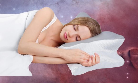 Cozyplayer pillow with a woman sleeping on it.