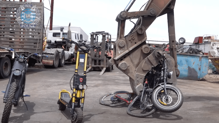 a large machine crushes an ebike