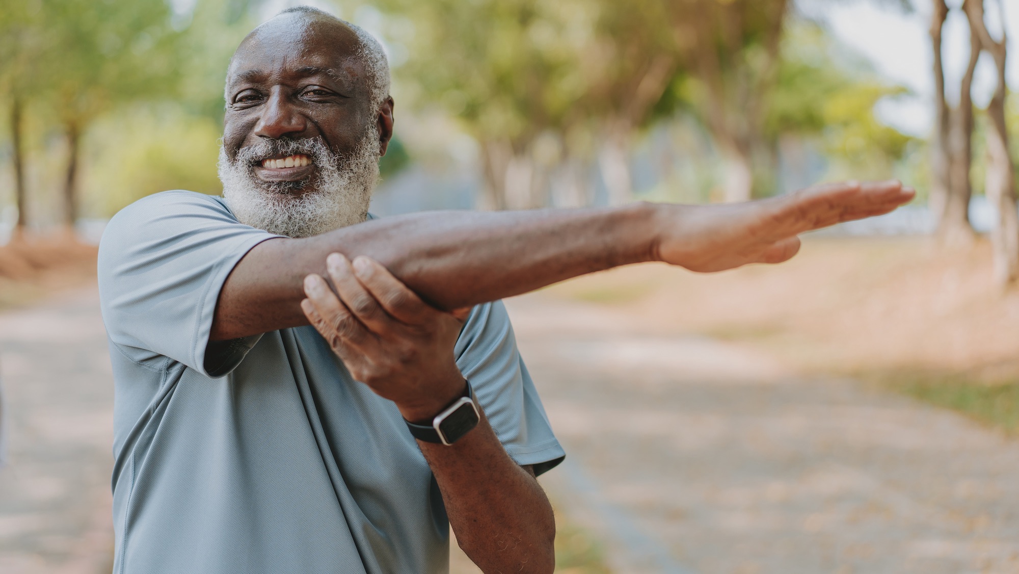 Black man portrait and stretching for outdoor exercise