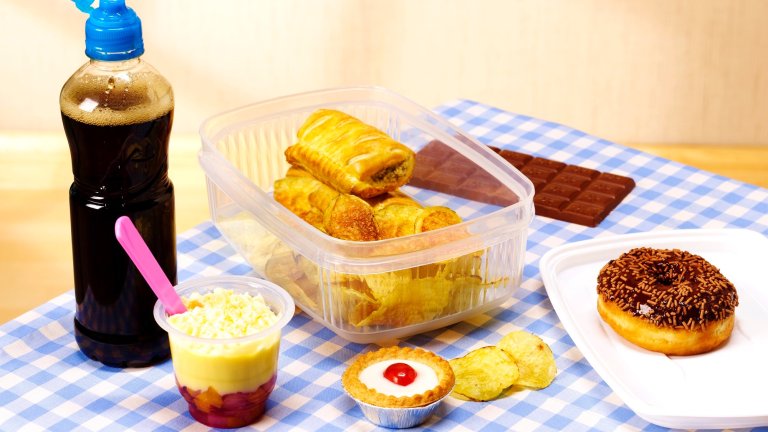 unhealthy lunch box on table cloth