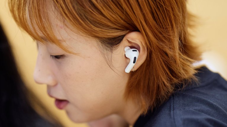 woman with airpod in ear