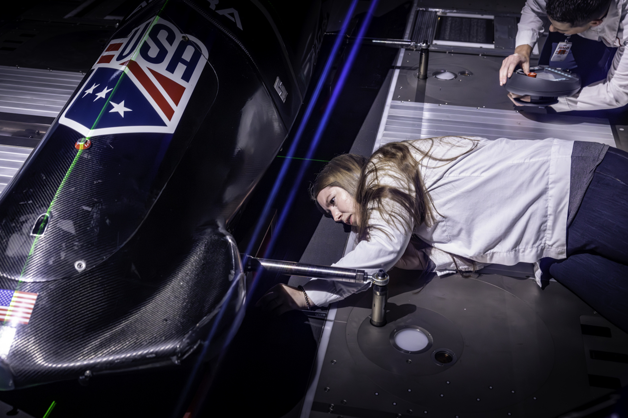 a woman engineer working on a bobsled