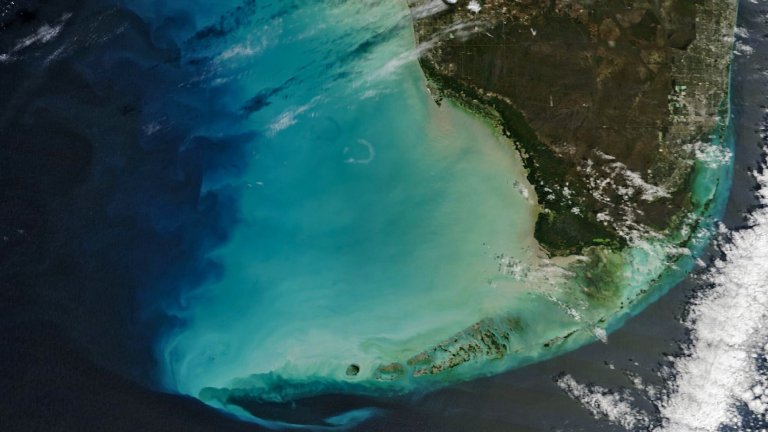 Satellite image of southern tip of Florida showing bright blue waters off west coast caused by winter storm weather