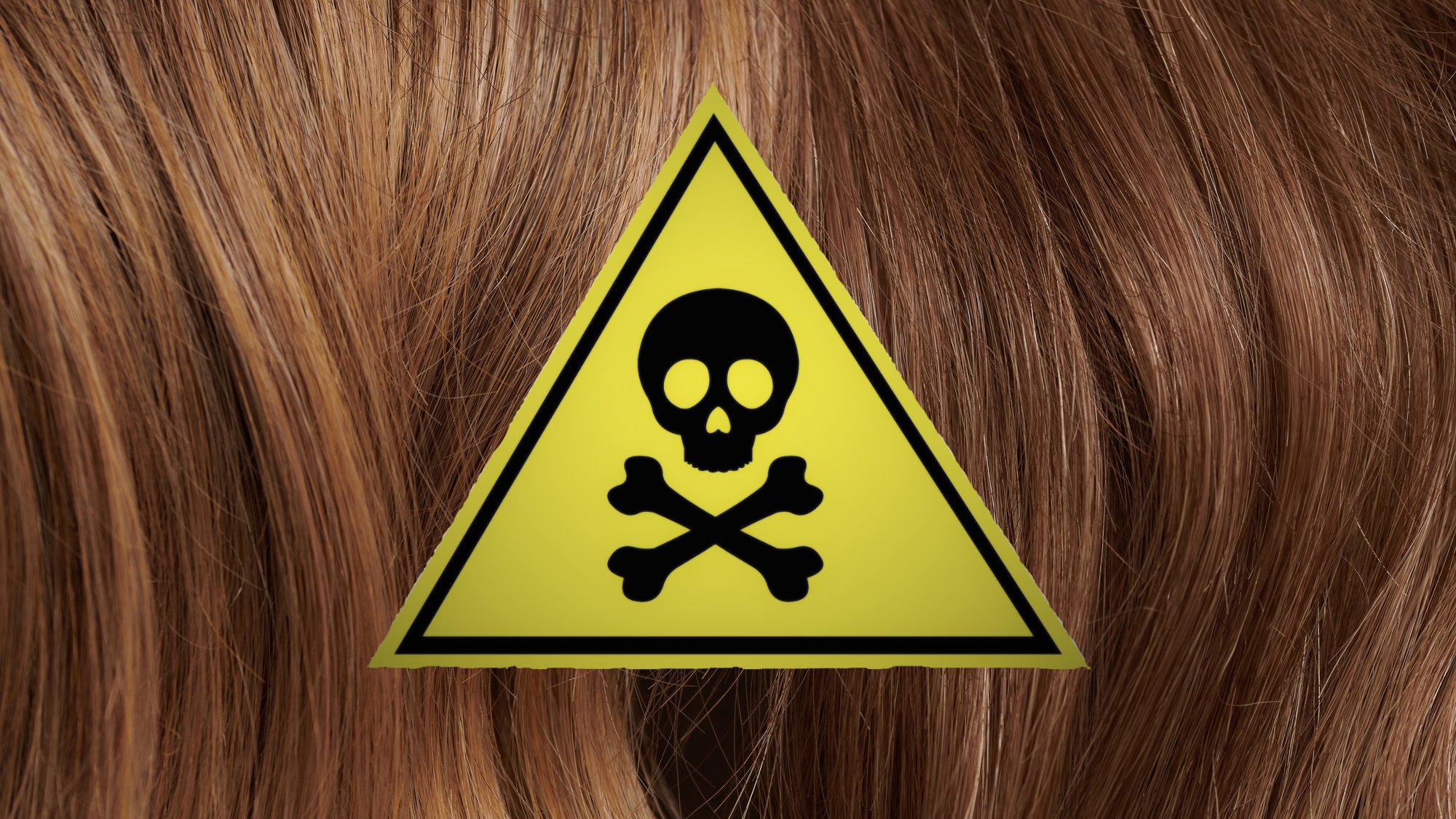 Poison warning label layered atop brown hair