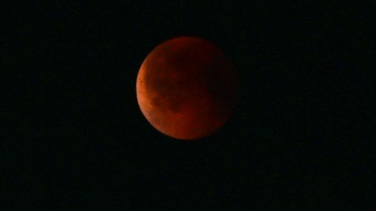 a red moon due to a total lunar eclipse