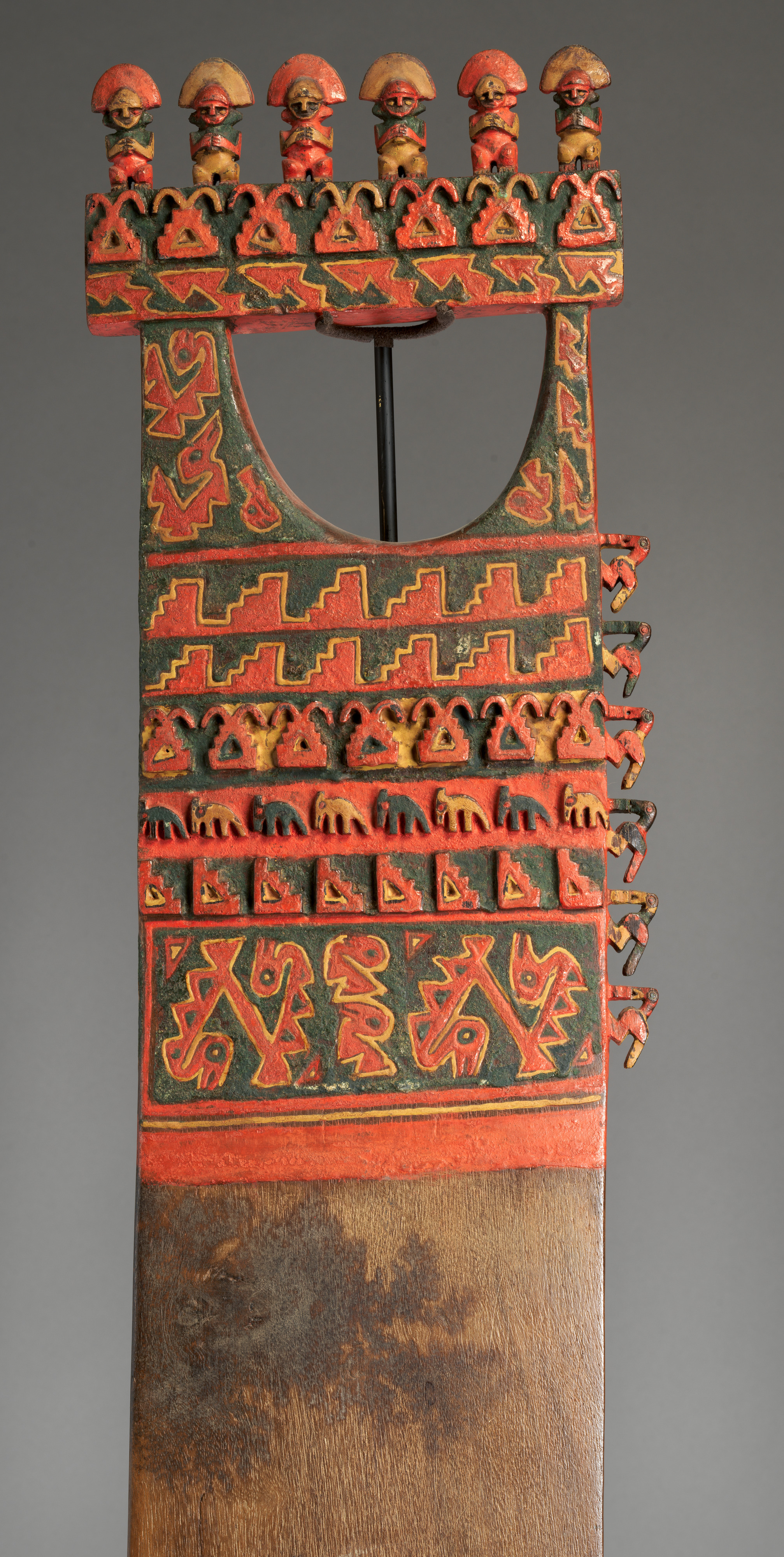 Ceremonial digging stick or paddle from coastal Peru showing seabirds and possible maize sprouting from abstracted fish and stepped-terrace motifs. 