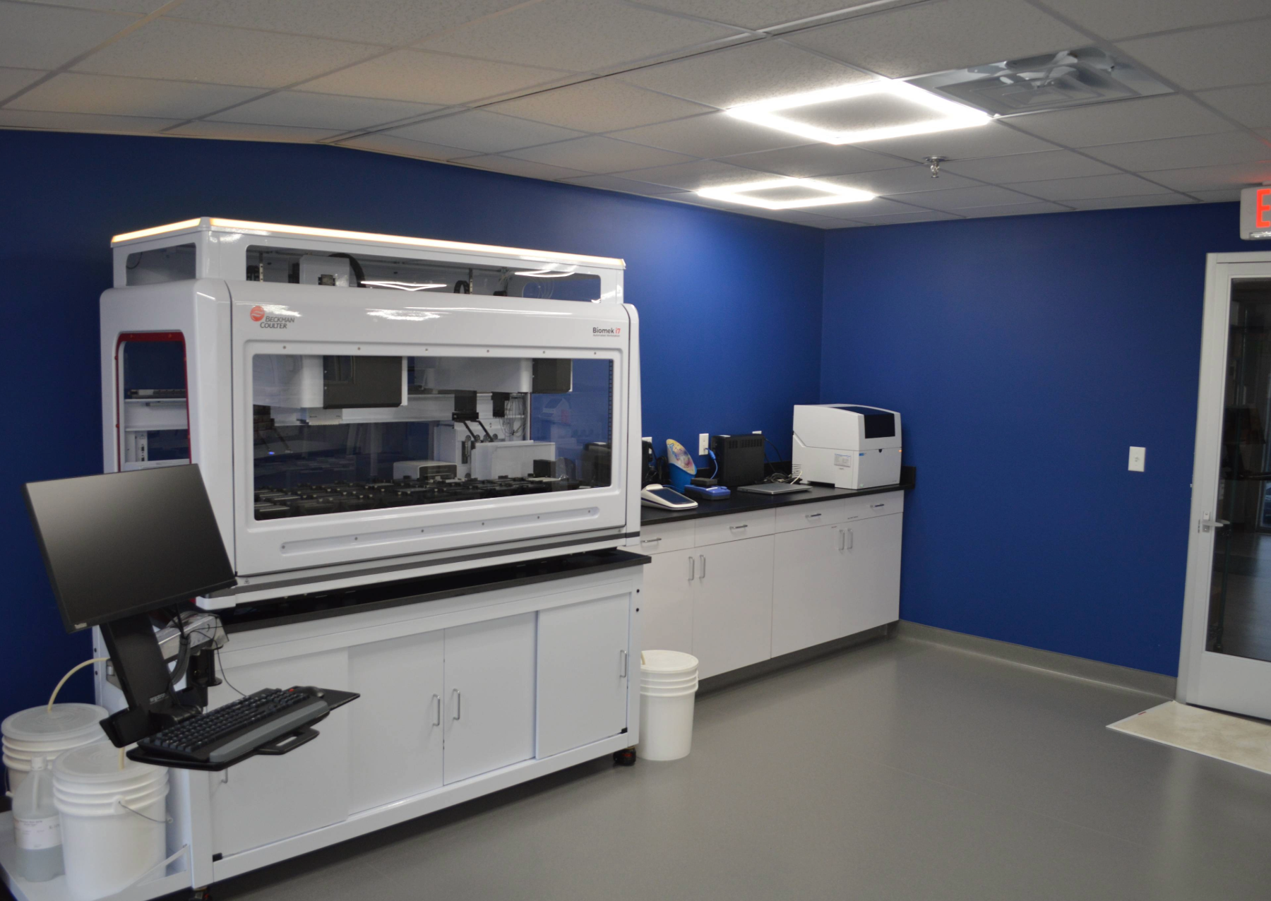 a laboratory with white cabinets
