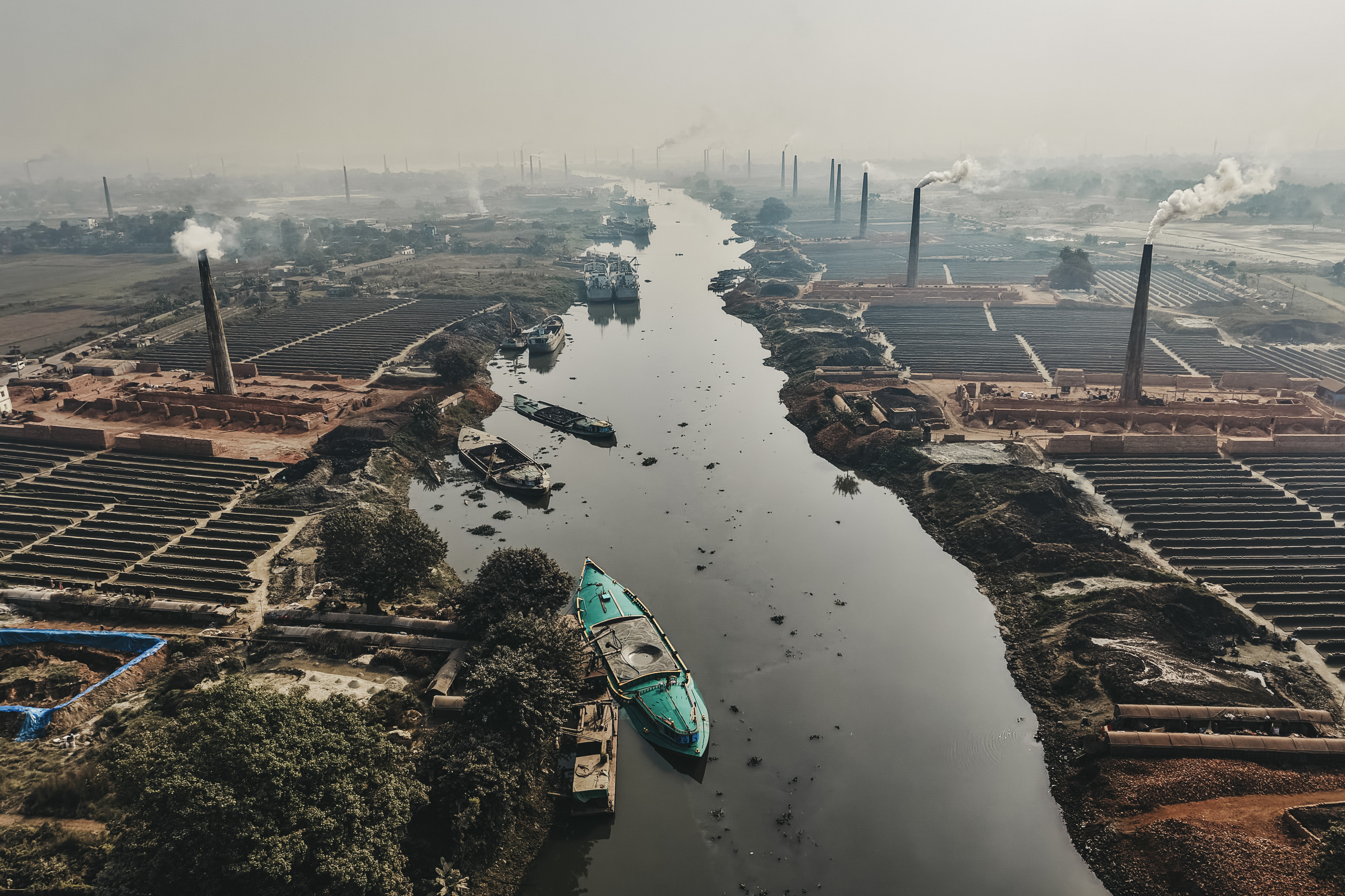 Outside Dhaka, numerous brick factories fill the Buriganga River with particles.