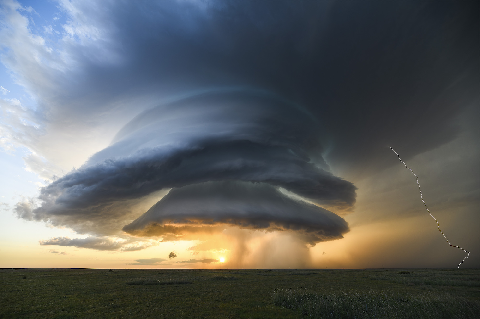 A UFO-style supercell slowly morphs over the southern High Plains of New Mexico, bringing some of the best structure Tornado Alley has to offer.