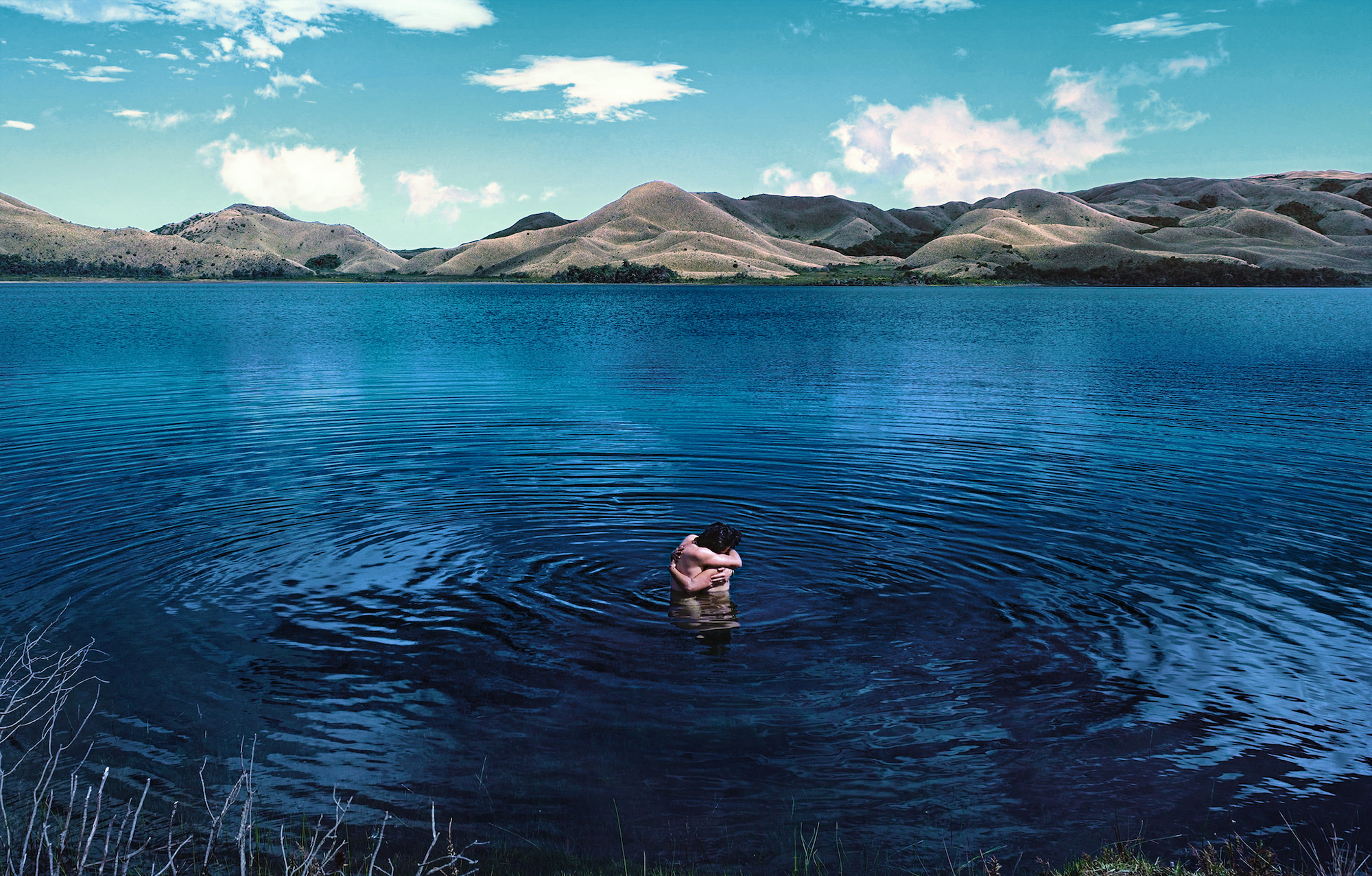 two people hugging in a lake