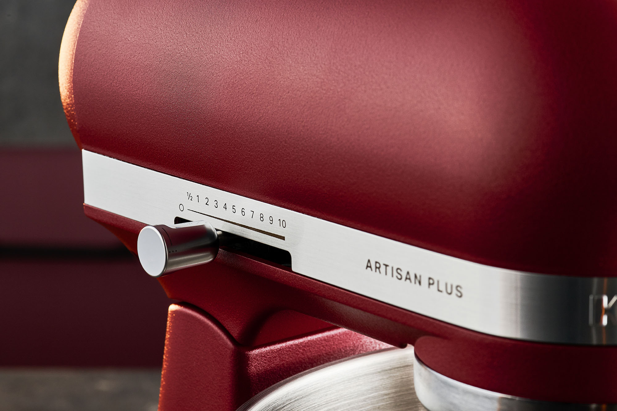 A crinkle-finish Sundried Tomato Artisan Plus tilt-head stand mixer close-up shows the new speed settings