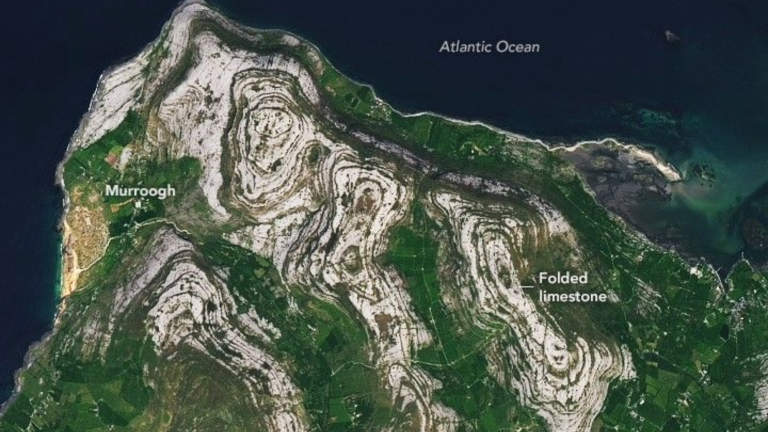 a satellite image of ireland's west coast showing gray rocks surrounded by green