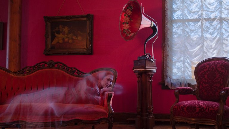 19th century female ghost listening to phonograph