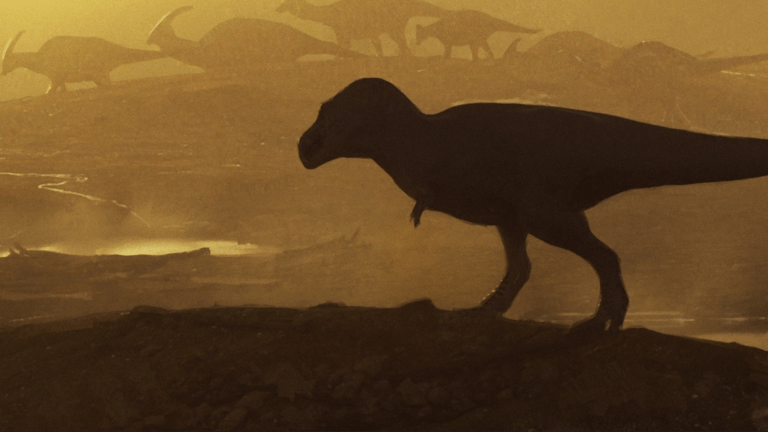An artist’s illustration of a giant tyrannosaur watching the duckbill dinosaur ‘Parasaurolophus’ in New Mexico during the late Cretaceous (74-75 million years ago).