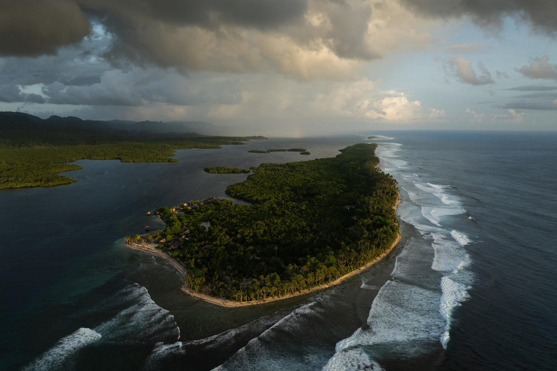 Title: The Last Dolphin Hunters Credit: © Matthew Abbott, Oculi, for The New York Times Caption: Fanalei Island has been reduced to a narrow strip of sand and coral by rising seas. Residents believe the settlement, once home to dozens of families, will become uninhabitable in the near future. South Malaita, Solomon Islands, 6 February 2025. Story: Fanalei, a low-lying island in the Solomon Islands, stands at a crossroads between contested tradition and a changing economy. For generations, dolphin hunting provided food and income, with dolphin teeth used as ritual currency for bride-price and other forms of local exchange. Today, as rising sea levels displace the community and threaten its future, seaweed farming is providing an economic alternative to the seasonal hunt. As seaweed farming expands, fewer people are available for the collective efforts upon which dolphin hunting depends. This story captures a community reshaped by environmental pressure and shifting traditions.