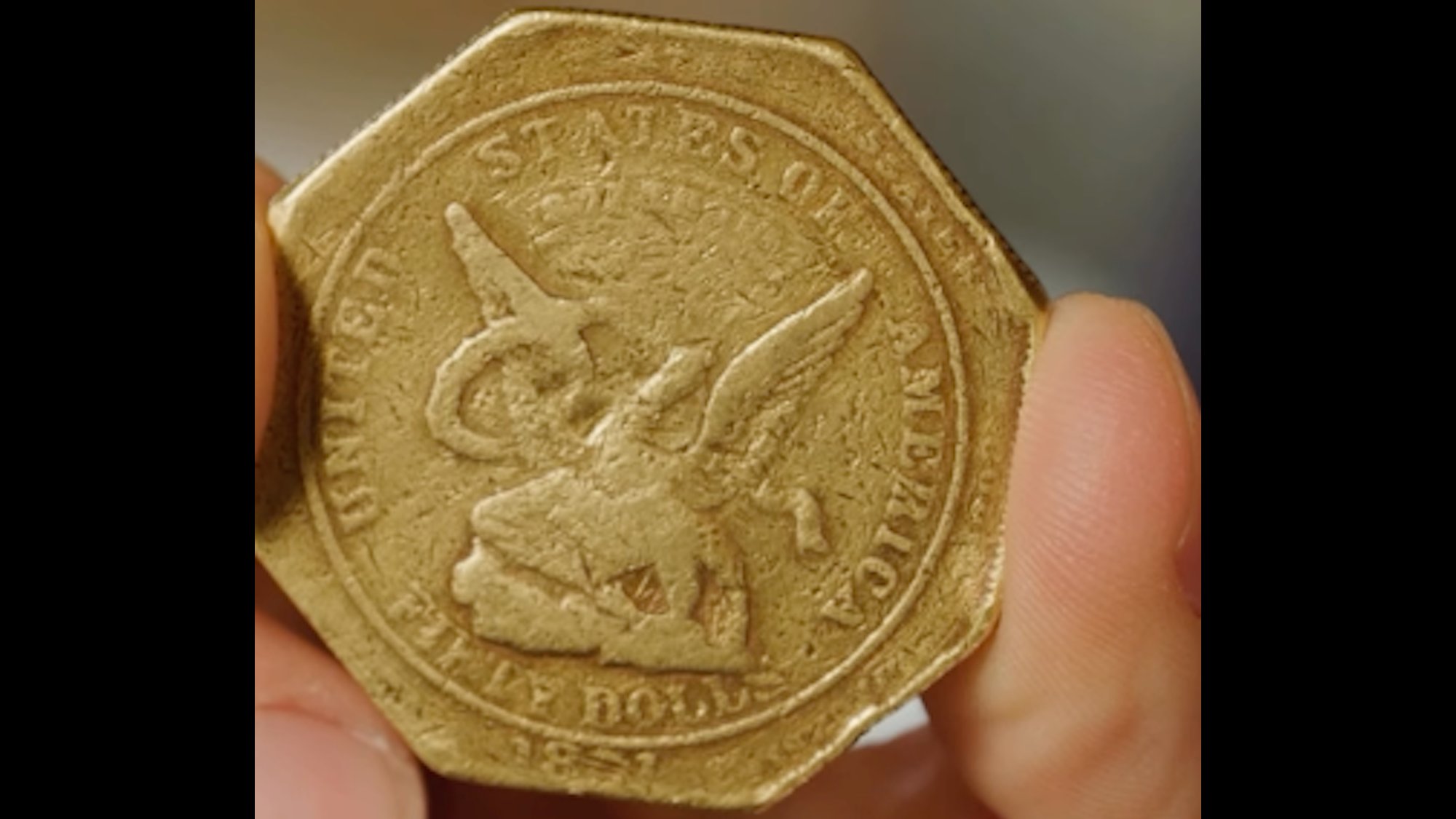 Close up of 1851 Humbert Slug gold coin