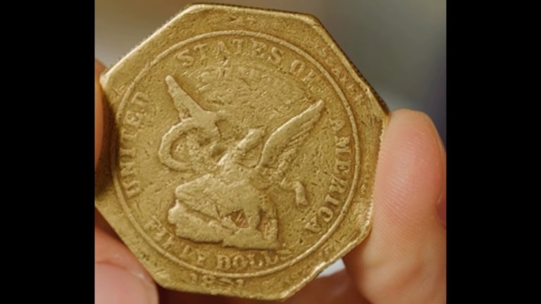 Close up of 1851 Humbert Slug gold coin