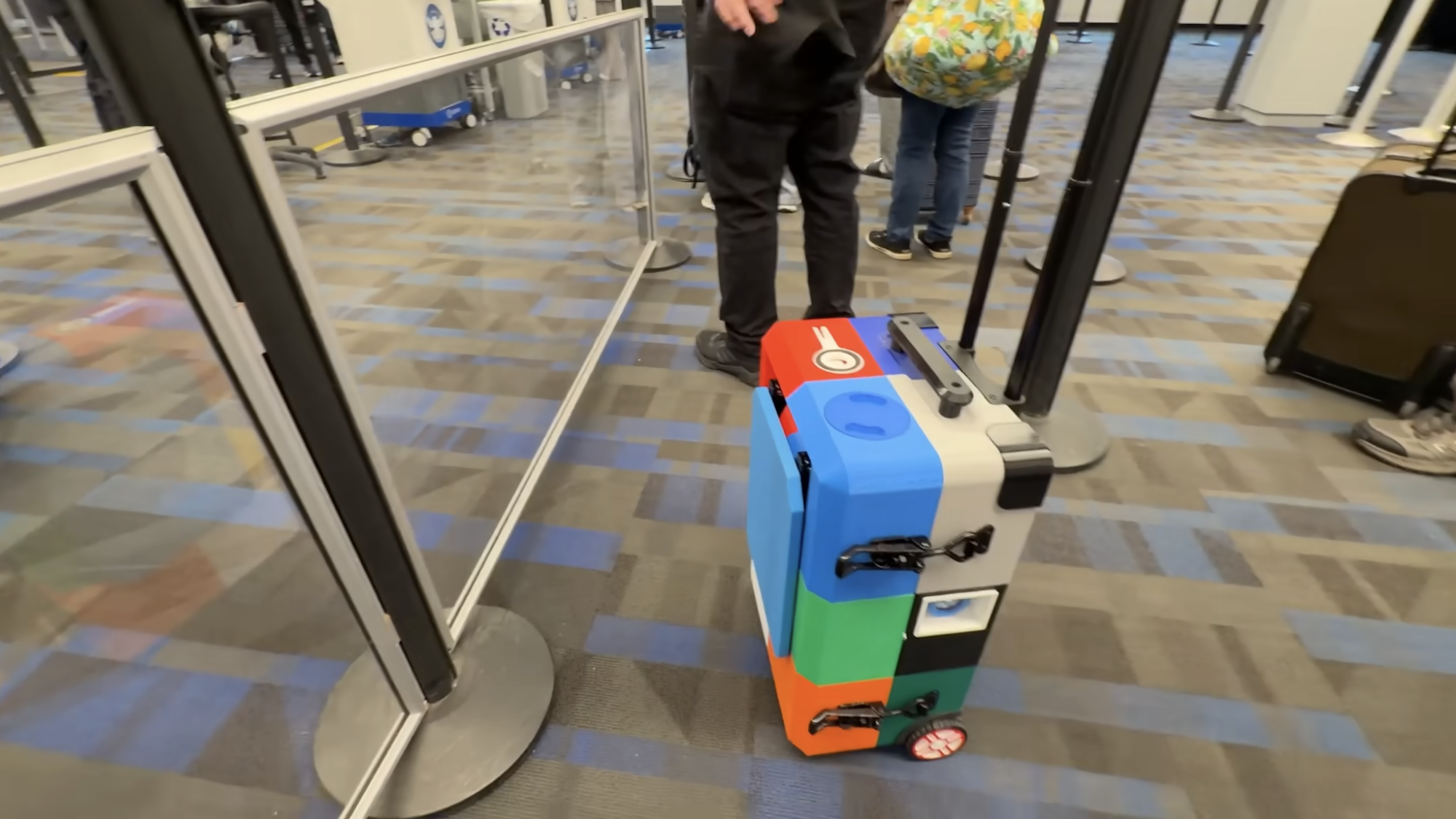 3D-printed suitcase includes foldout table, cup holder, and a secret snack compartment