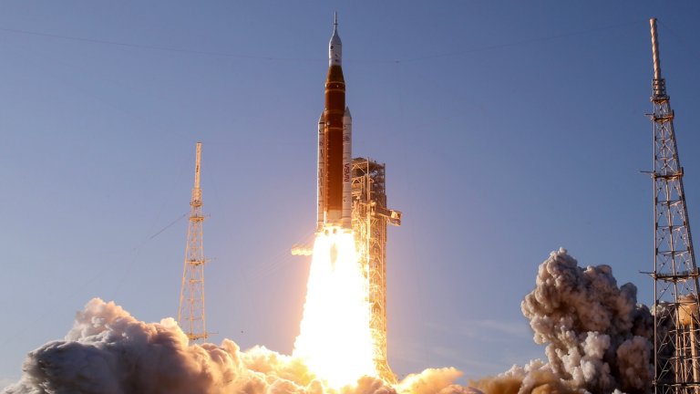 NASA's Artemis II Space Launch System rocket carrying the Orion spacecraft lifts off from Launch Complex 39B at Kennedy Space Center on April 1, 2026 in Cape Canaveral, Florida. A fiery flare erupts from the rocket sending off plumes of smoke.