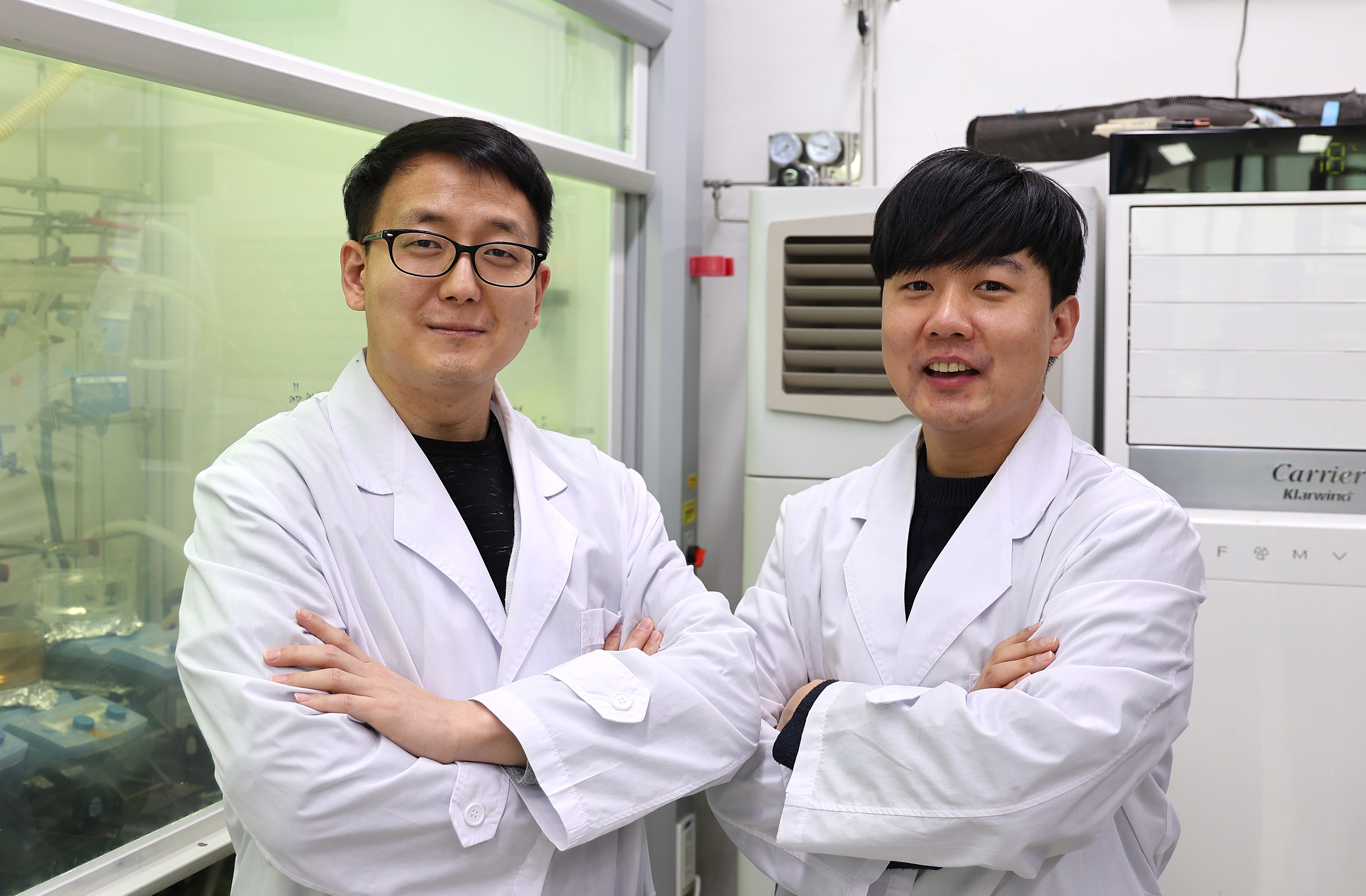 two men in white coats