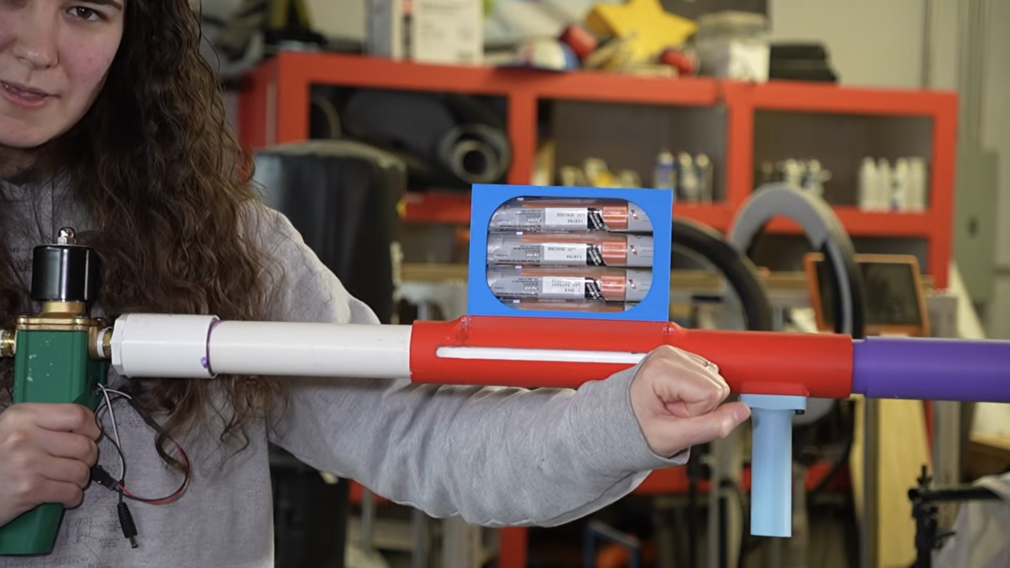 Close up of woman holding EpiPen Launcher
