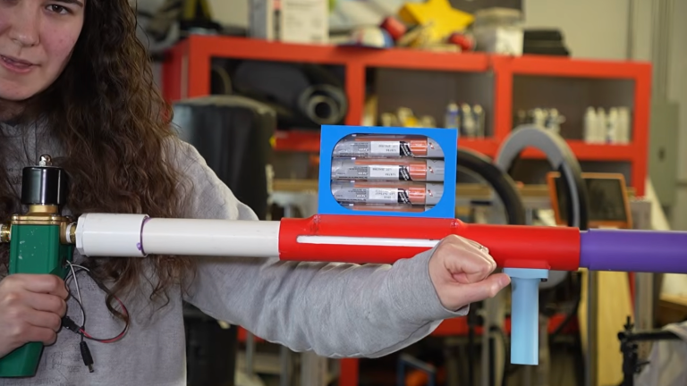 Close up of woman holding EpiPen Launcher