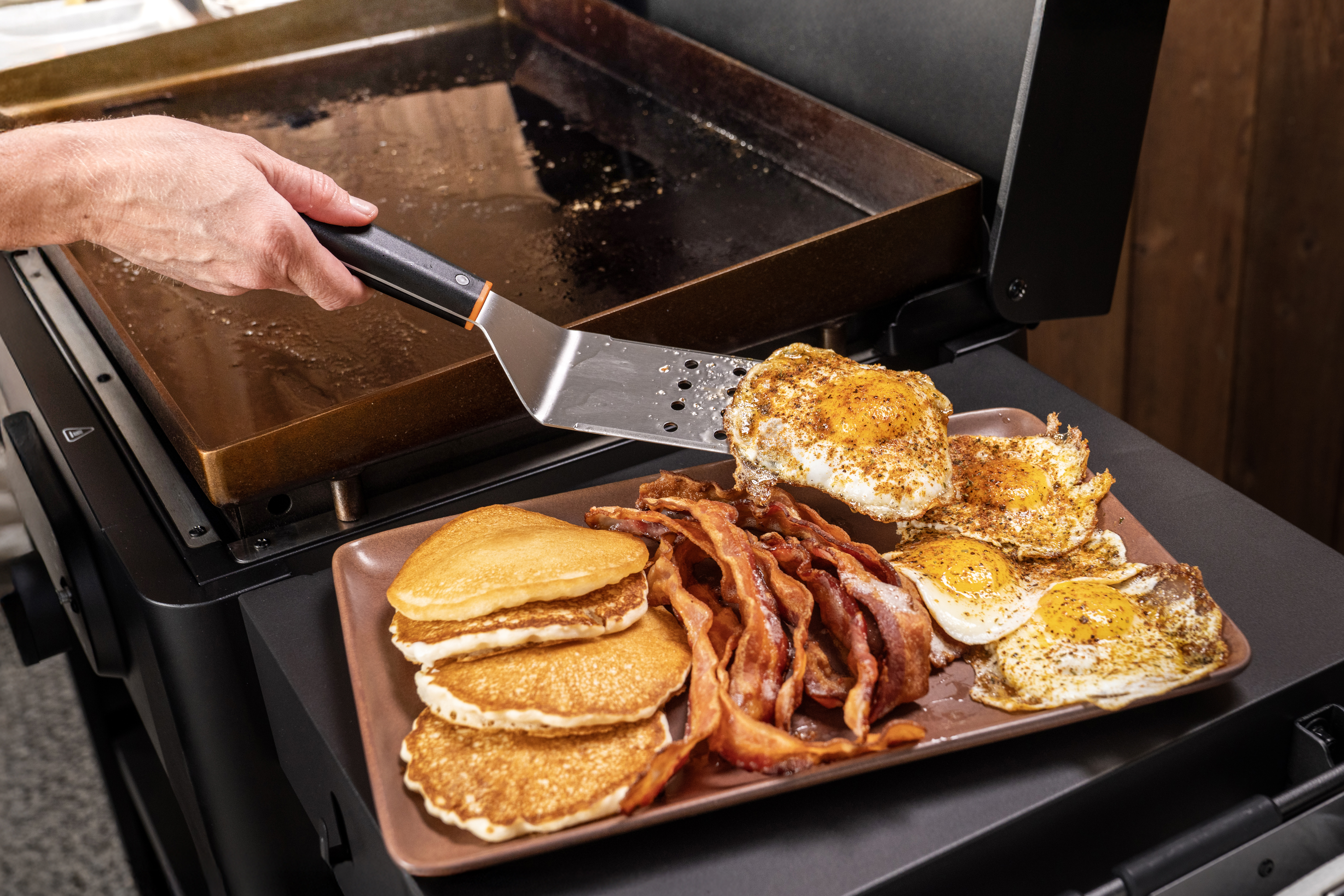 Traeger Irontop griddle in use with breakfast