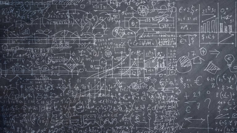 Math equations covering a chalkboard