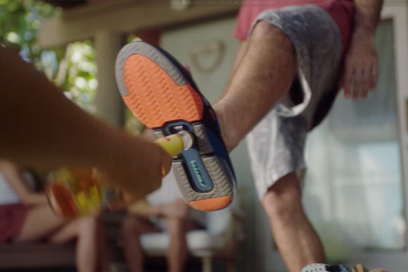 Your bro cracking a cold one with the bottle opener on the bottle of the iconic REEF Fanning + flip-flop