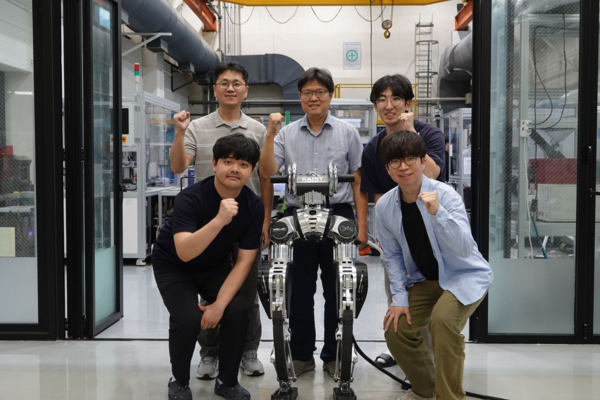 team of engineers holding up fists