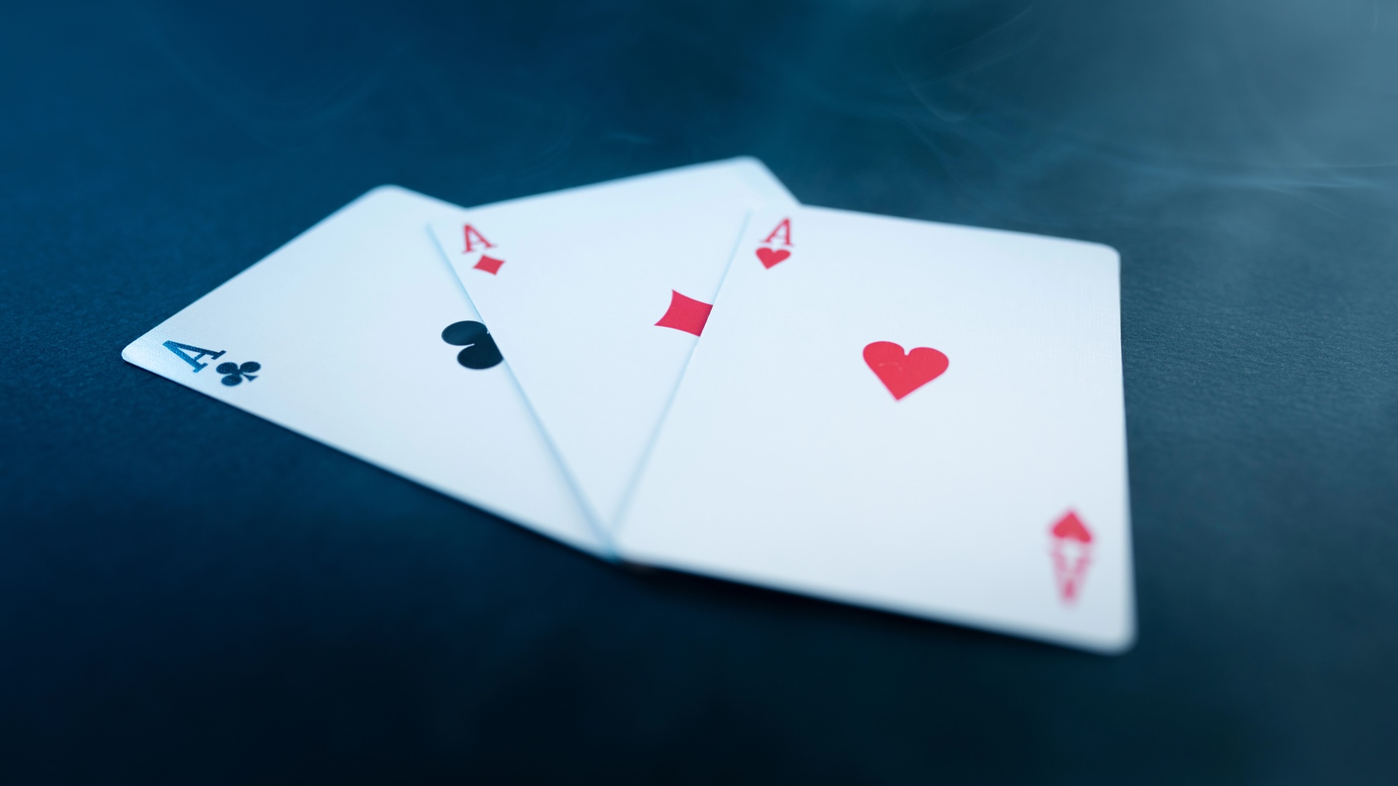 Overlapping ace of clubs, diamonds, and hearts