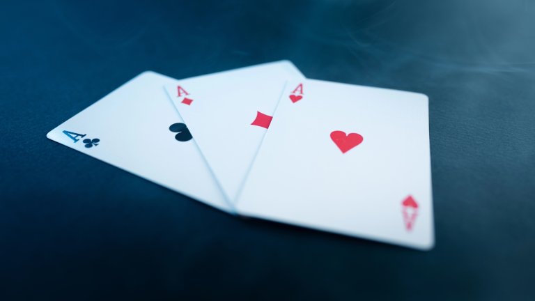 Overlapping ace of clubs, diamonds, and hearts