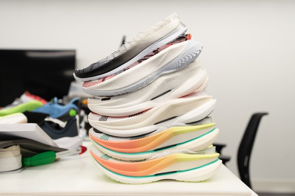 A stack of torture-tested Velociti stacks, well, stacked on a table in the Under Armour innovations lab