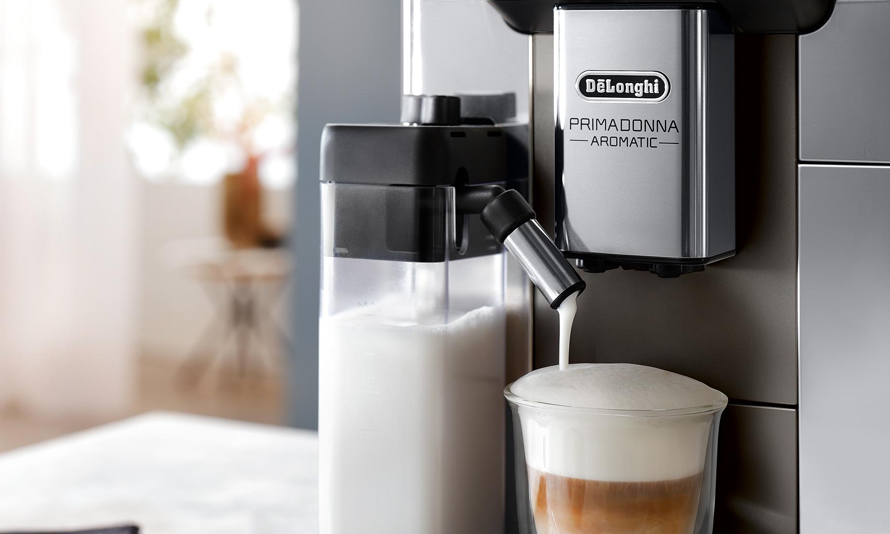 De'Longhi PrimaDonna Aromatic automatic espresso machine making a capuccino