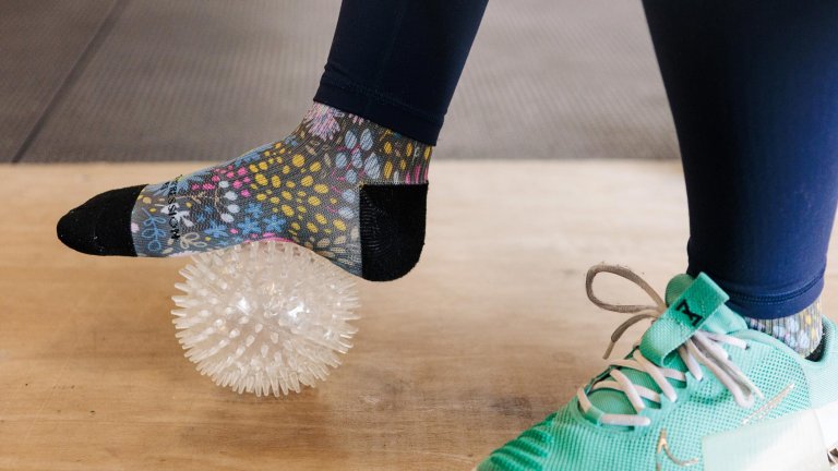 foot on spiky ball