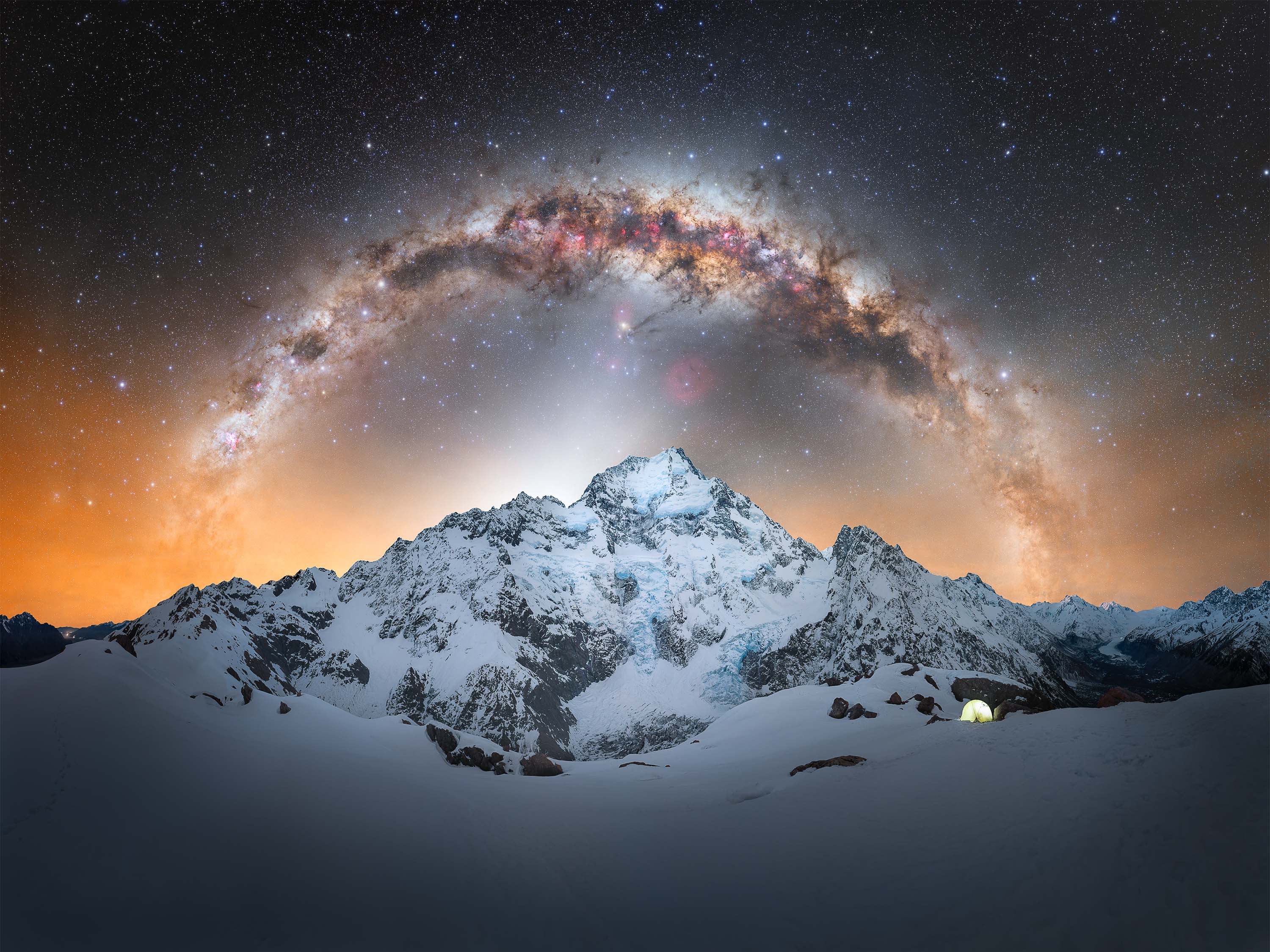 My goal with astrophotography has always been to combine my passion for mountains, adventure, and the landscapes of New Zealand. Capturing the Milky Way arch above Aoraki / Mount Cook, the central peak of the national park, became one of the most demanding challenges I had set for myself. Reaching this location required drawing on my experience as a mountaineer, navigating steep rocky terrain and snow-covered slopes under winter conditions. The route presented constant challenges, including large washouts along the mountainside, unstable snow affected by solar radiation, and the demands of winter camping at altitude. The effort required both physical endurance and careful decision-making throughout the journey. Despite these difficulties, the environment offered extraordinary conditions. As night fell, the Milky Way and zodiacal light appeared with exceptional clarity, enhanced by the cold, stable air at elevation. Being positioned so close to Aoraki added a sense of scale and intensity to the moment, especially as the western arc of the Milky Way moved into alignment above the mountain. With only a brief window to capture the scene, there was little margin for error. This image represents that single opportunity, where preparation, experience, and timing came together to document a moment that felt both challenging and deeply rewarding.