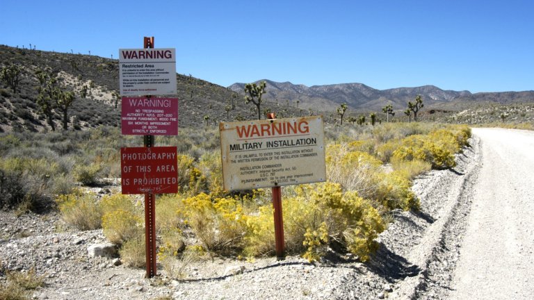 Warning signs near Area 51 prohibiting trespassing and photography