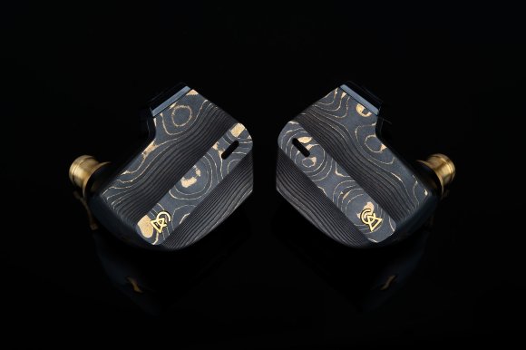 Damascus black Campfire Audio Chimera in-ear monitors shown on a black background