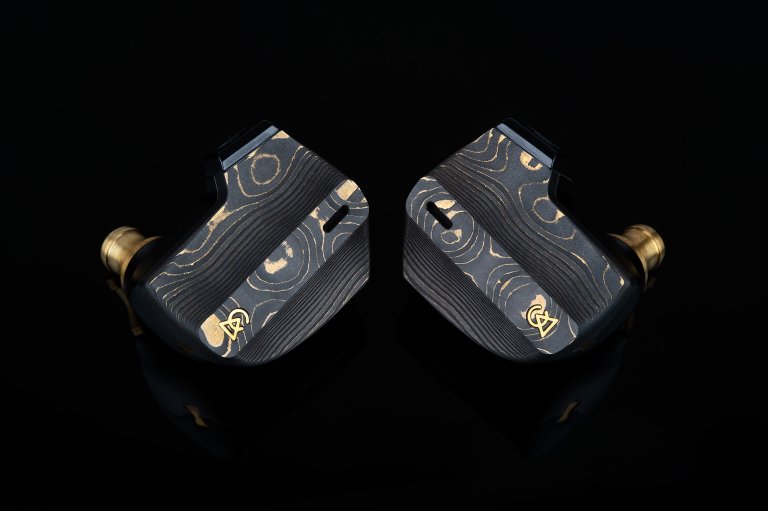 Damascus black Campfire Audio Chimera in-ear monitors shown on a black background