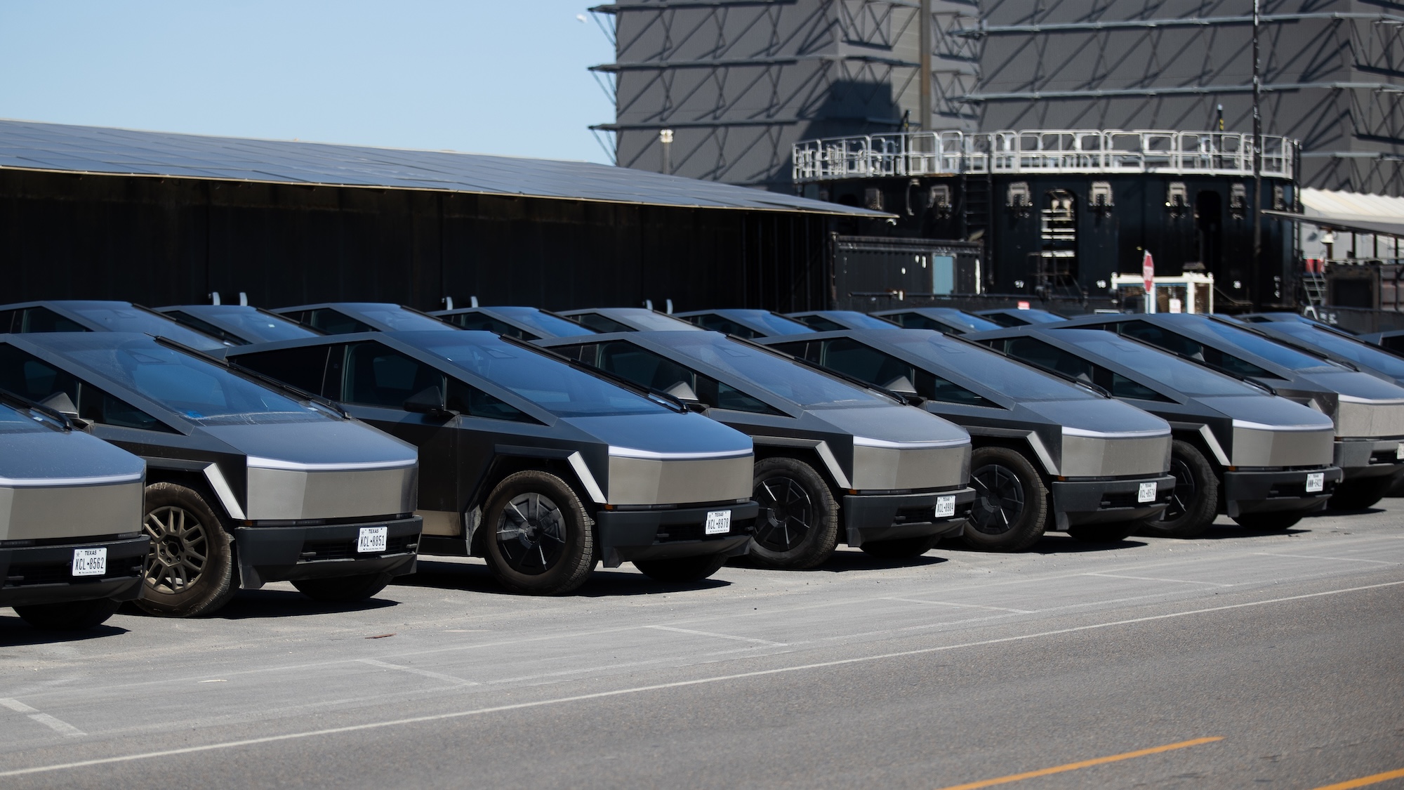 Line of Cybertrucks in parking lot