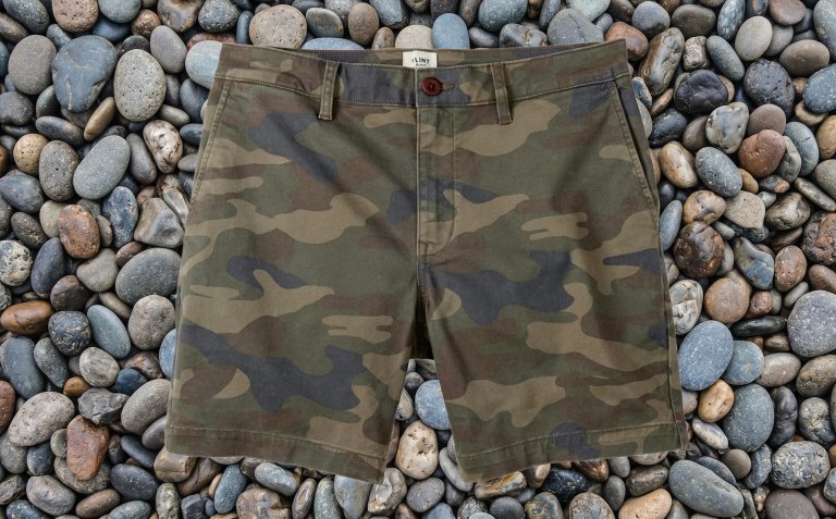 Huckberry Flint and Tinder 365 Chino Short - 7" in front of stones