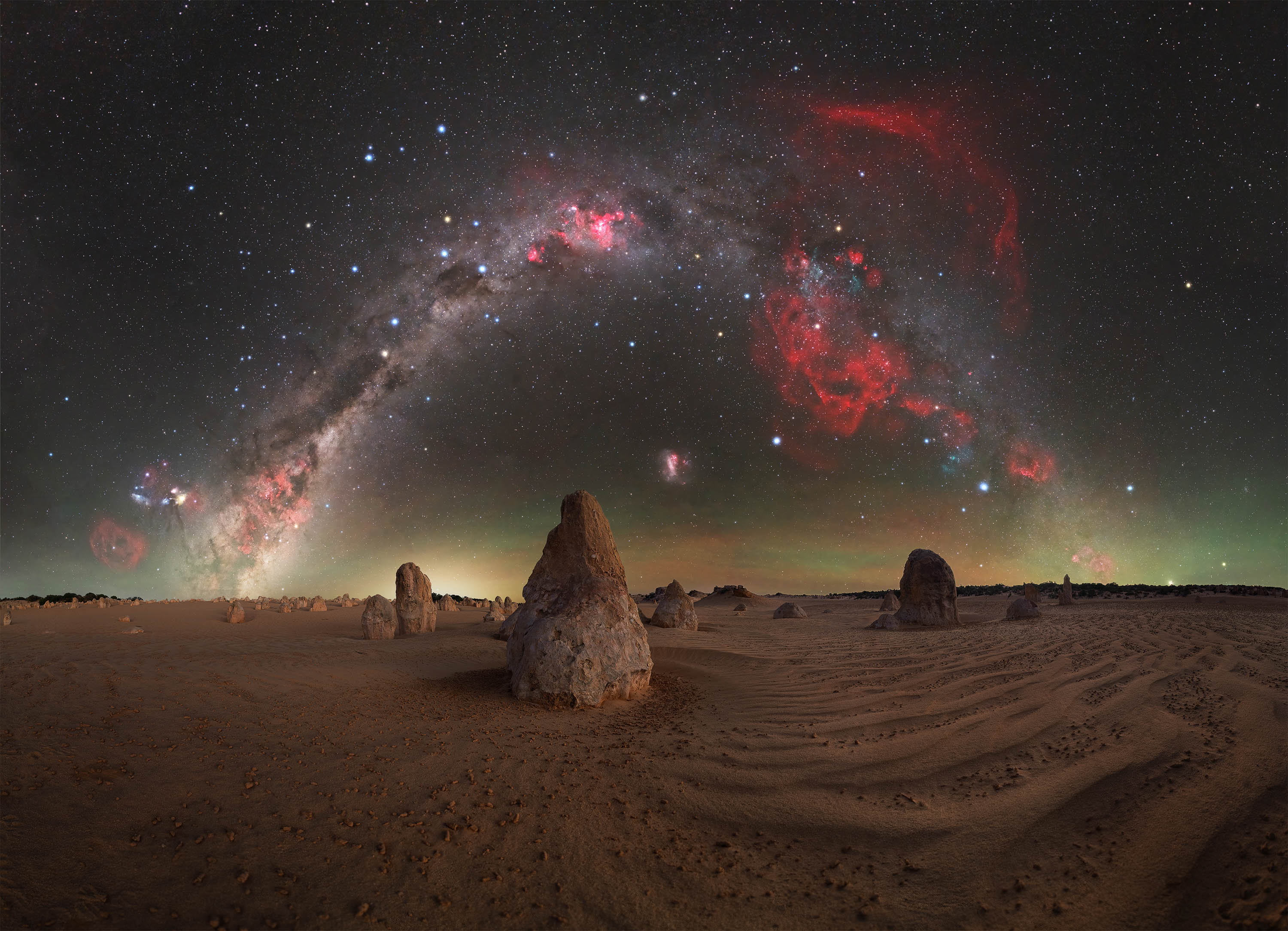 There’s something uniquely powerful about a calm, windless night in the Pinnacles Desert, a place that never fails to remind me how fortunate we are to have such pristine dark skies so close to home, just a short drive away. As the sun sets beyond the Indian Ocean, a profound stillness settles over Nambung, transforming the landscape into an almost otherworldly scene and drawing me back here time and time again. In this composition, the main limestone pillar aligns almost perfectly with the South Celestial Pole, anchoring the image beneath the rotating sky. To the right, the faint but unmistakable red glow of the Gum Nebula, a vast supernova remnant, adds depth and scale to the scene. Western Australia offers some of the finest night skies in the world, yet it’s easy to take them for granted. Nights like this serve as a reminder of just how special these quiet, remote corners of the Wheatbelt truly are.