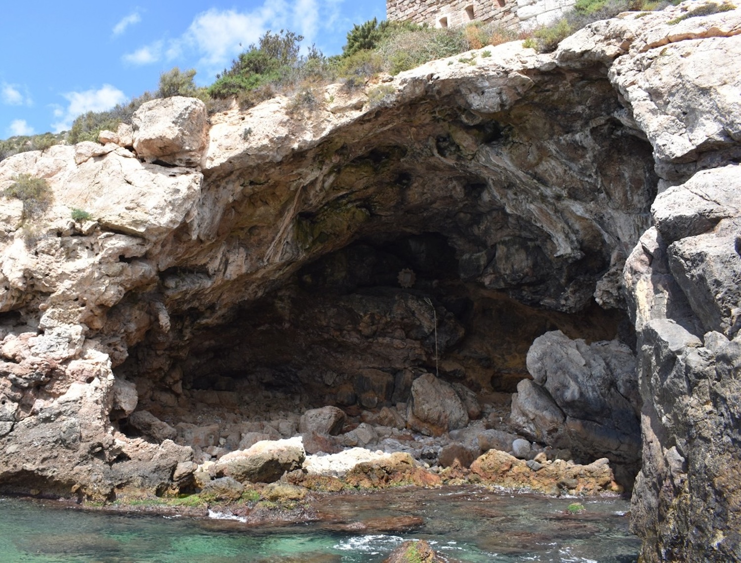 Cave next to ocean water
