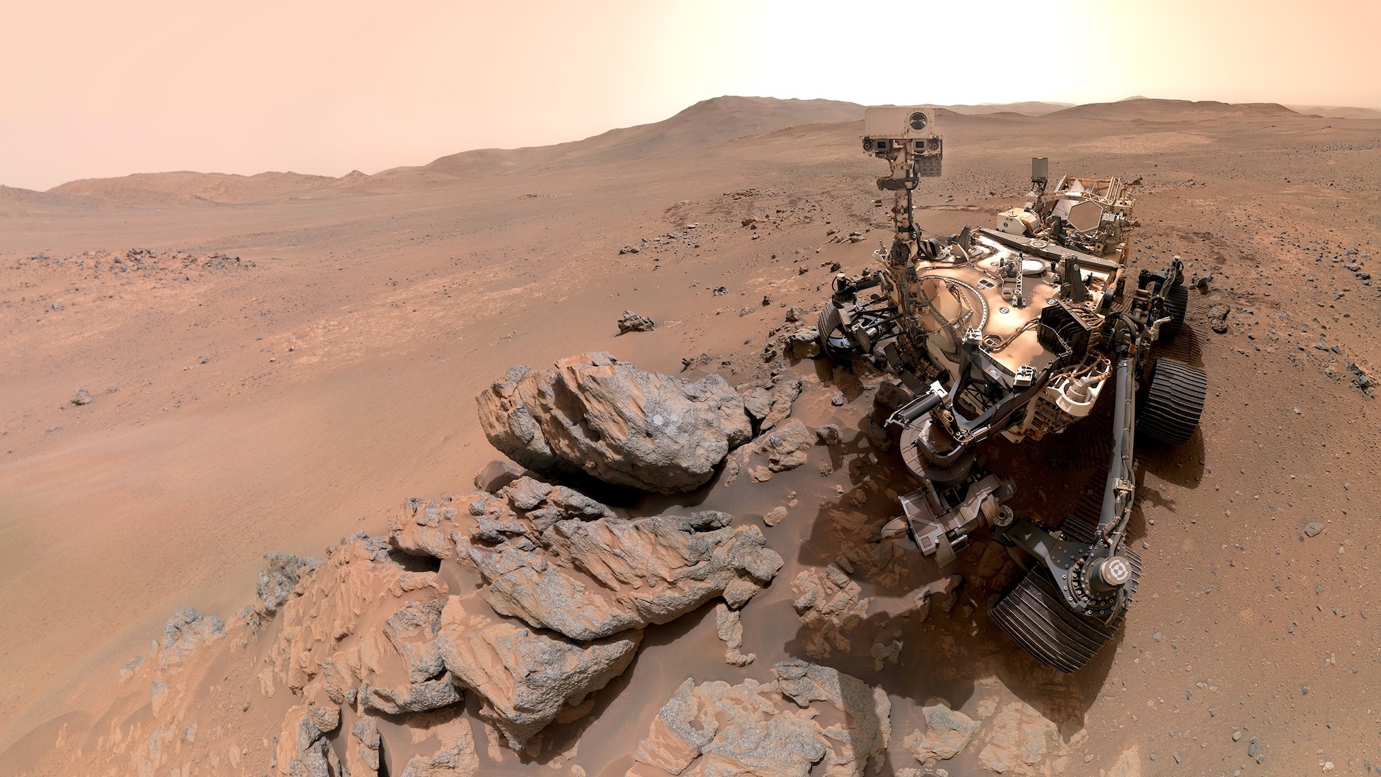 Perseverance Mars rover selfie photo with Martian landscape behind it